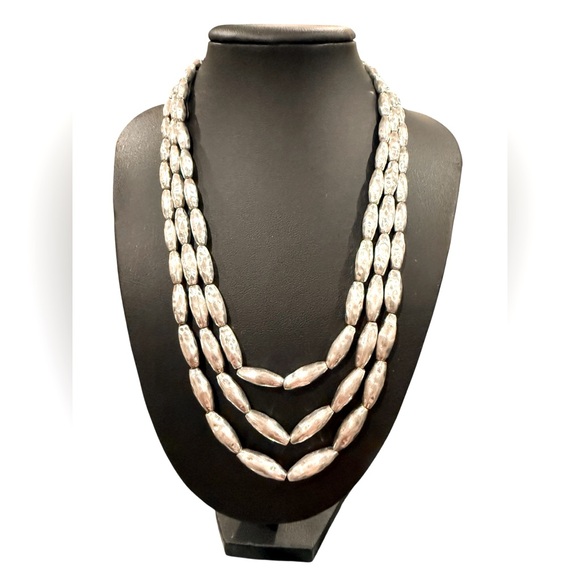 vintage Monet three-strand necklace featuring hammered silver-tone beads. - Picture 1 of 5